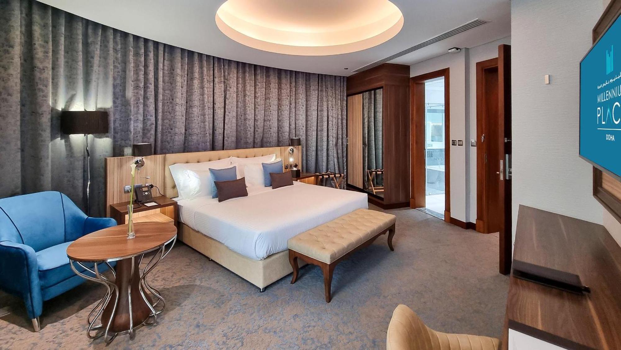 Millennium Place Доха Экстерьер фото A bedroom at the hotel